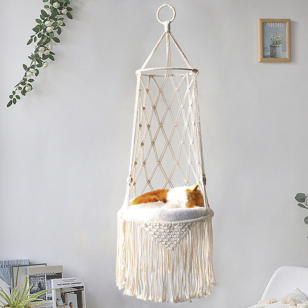 Macrame Hanging Cat Bed hanging in a living room